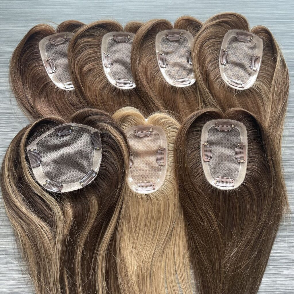 Wholesale human hairpieces for women thinning hair featuring natural-looking human hair toppers with clip-in bases, multiple colors, realistic scalp designs, and premium hair replacement solutions for salons, distributors, and private label brands.